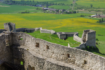 Fototapeta na wymiar Inside the walls of Spis Castle with panorama of meadows - Spissky hrad National Cultural Monument (UNESCO) ruins of medieval castle, Slovakia