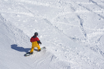 Fototapeta na wymiar freeride snowboarder kicks off the track,