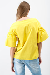 Young woman in a yellow blouse