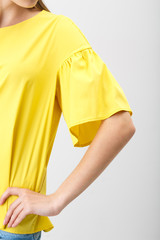 Young woman in a yellow blouse