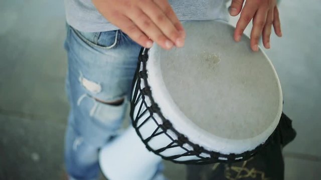 man plays a drum