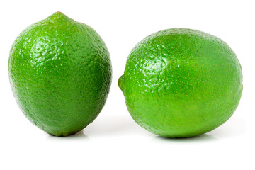 two lime isolated on white background close up