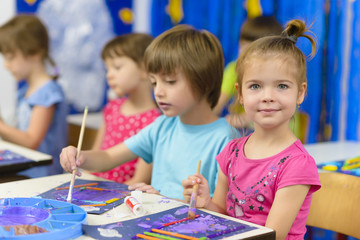 Kid Painting at Kindergarten