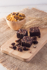 Delicious chocolate fudge brownie with pecan and walnut served