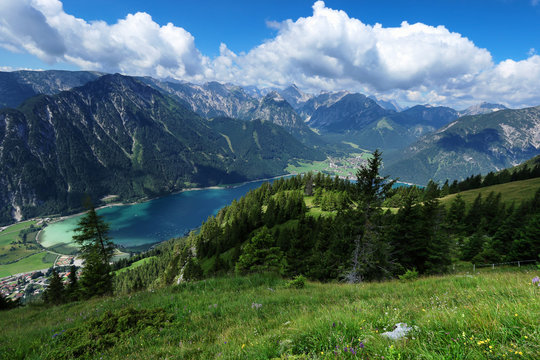 High mountains view with blue lake. Achen Lake, Achensee, Tyrol, Austria