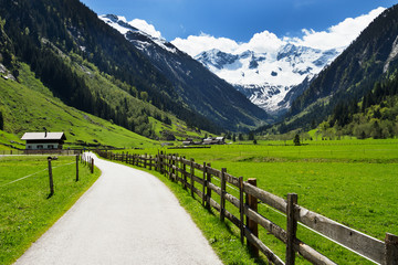 Fototapeta na wymiar Mountain scenery way and wooden fence in Stilluptal Mayrhofen Austria Tirol