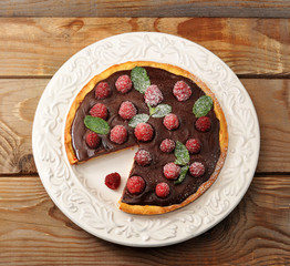 Cake with raspberries and chocolate