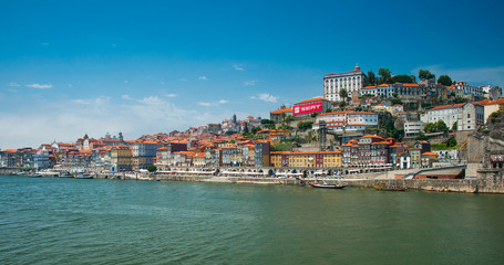 Fototapeta na wymiar Old town cityscape on the Douro River with traditional Rabelo boats in Porto, Portugal