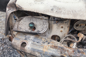 Fototapeta na wymiar Headlight area of a burnt out car