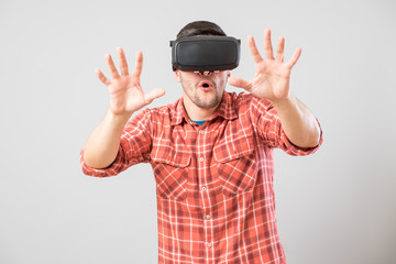 Man with virtual reality glasses showing gesture