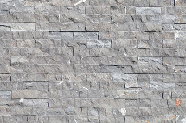 Gray stone block wall background and texture
