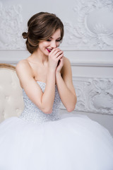 Naklejka premium Portrait of beautiful bride. Wedding decoration and dress, white background