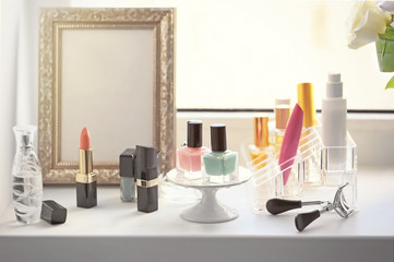 Cosmetic set on white windowsill