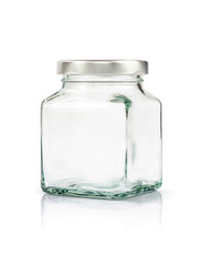 Clear glass bottle with silver cap isolated on white background