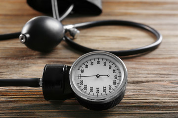 Medical manometer on a wooden background