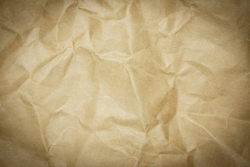 Recycled crumpled brown paper texture or paper background for design with copy space for text or image.