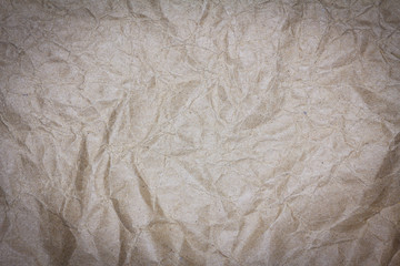 Recycled crumpled brown paper texture or paper background for design with copy space for text or image.