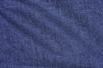 Dark blue cotton bath towels texture or towels background for design with copy space for text or image. Dark edged.