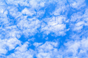 Obraz premium Blue sky background with white clouds. The vast blue sky and clouds sky on sunny day. White fluffy clouds in the blue sky.