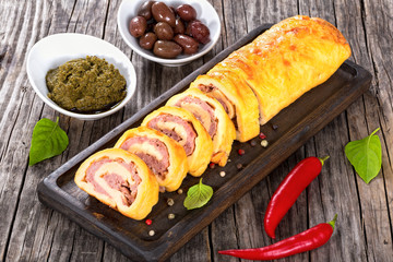 cheese spicy meat Roll-Ups on cutting board,view from above