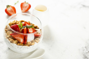 Homemade dessert with granola and berries