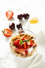 Homemade dessert with granola and berries