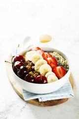 Breakfast bowl with fruits, seeds and berries