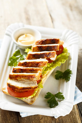 Sandwich with chicken and tomatoes
