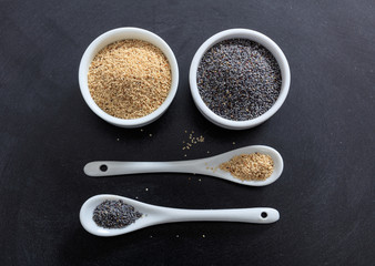 Poppy seeds in porcelain bowls and spoons