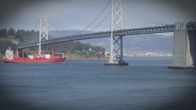 Red cargo ship in the waters of San Francisco Bay, California