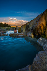 Naklejka premium Woman relaxes in Travertine Hot Springs California USA Vertical Composition with copy space