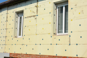 Close up on Exterior House Wall Insulation with Styrofoam Sheet Insulation. House Energy Saving...