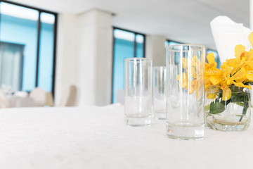 wooden table in dining room with elegant table setting