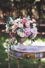 Сream-colored wedding ceremony with fresh flowers