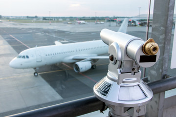 Visitors terrace with views over runway of International Airport with the airplane