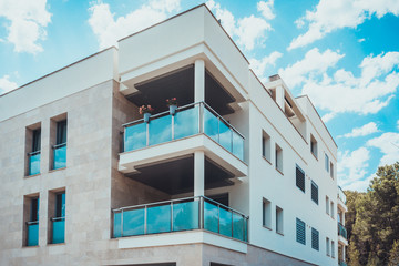 Blue balcony barrier in corner of apartments