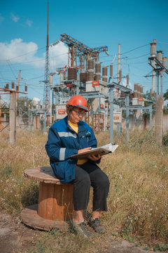 Electricians on high voltage substation