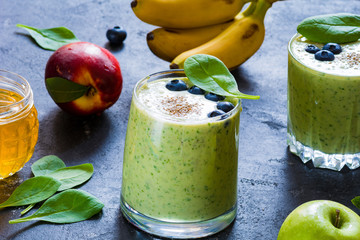 Green smoothie, detox healthy drink with spinach, banana, blueberries and chia seeds