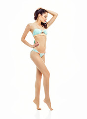 Fototapeta premium Sexy young brunette woman posing in a bikini.Beautiful perfect f