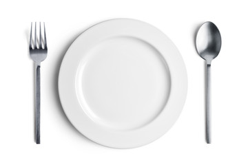 White plate with silver fork and spoon with clipping path