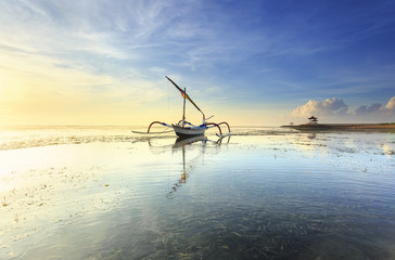 Bali, Indonesia. Fishing boats populate the shoreline at the Sanur beach