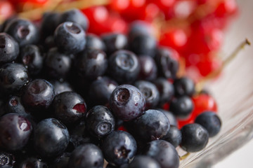 a combination of black and red berries (blackberries and red cur