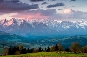 Beautiful spring panorama over Spisz highland to snowy Tatra mountains in the colorful morning,...