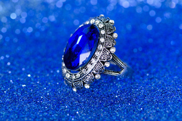 Jewellery ring against blue background