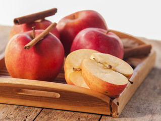 Red winter apples with cinnamon sticks
