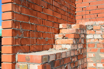 Close up on Bricklaying House Construction Site. Bricklaying Facing Brick Basics Masonry Techniques. How To Lay Bricks Like A Bricklayer. DIY Bricklaying.