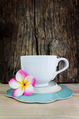 Big white cup coffee or hot drink on wood table and timber