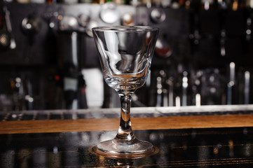 ampty cocktail glass on bar