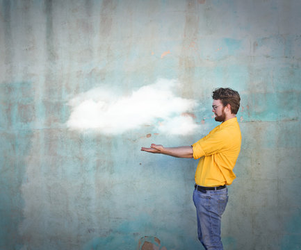 Man holding a cloud in his hands
