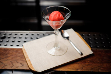 cocktail glass of strawberry dessert with sorbet,